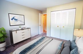 Garfield Heights apartment for rent - a bedroom with a bed and a window with white shutters