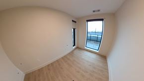 Dartmouth apartment for rent - A room with a window and wooden flooring.