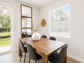 Fort Pierce apartment for rent - A dining room with a wooden table and chairs.