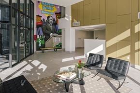 Bronx apartment for rent - A room with a glass table and two chairs.