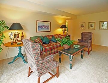 Farmington Hills apartment for rent - a living room with a couch and chairs and a table
