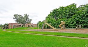 Farmington Hills apartment for rent - a playground with a slide in a park