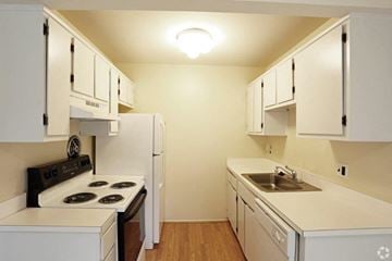Westland apartment for rent - a kitchen with a stove and a sink and a refrigerator