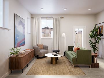 Washington Township apartment for rent - A living room with a green couch, a coffee table, and a painting on the wall.