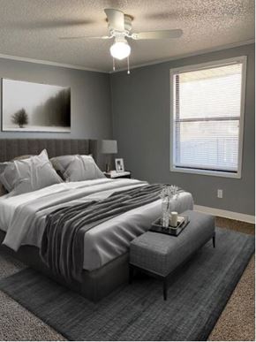 Ann Arbor apartment for rent - A bedroom with a bed, nightstand, and window.