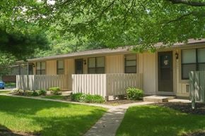 Newburgh apartment for rent - A small house with a brown door and a small porch.