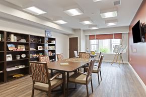 Brooklyn Center apartment for rent - A dining room with a table and chairs at Sonder Point 50+ Apartments, Brooklyn Center, MN