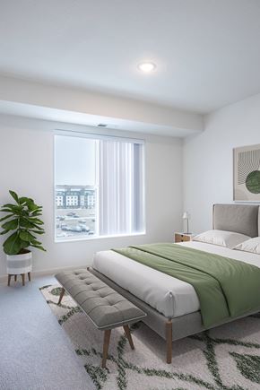 St. Louis Park apartment for rent - a bedroom with a bed and a chair and a window