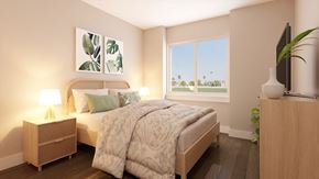 San Tan Valley apartment for rent - A bedroom with a bed, nightstand, and a window with a view of a green landscape.