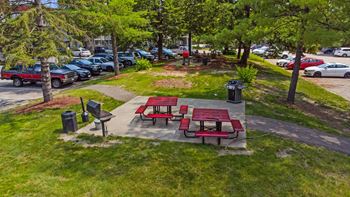Two picnic tables and benches