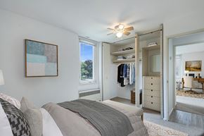 Saint Paul apartment for rent - a bedroom with a bed and a closet at Humboldt Senior 55+ Apartments, Minnesota