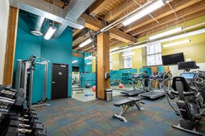 St. Paul apartment for rent - a workout room with weights and cardio equipment in a gym at Lowertown Commons Apartments, St. Paul, MN