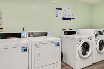 Washing machines and dryers in a laundry room