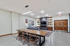 St Paul apartment for rent - a large dining room with a wooden table and chairs at Press House Apartments, St Paul, 55101