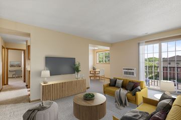 St Paul apartment for rent - A living room with a yellow couch and a flat screen TV mounted on the wall.