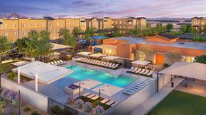 San Tan Valley apartment for rent - A large outdoor swimming pool surrounded by lounge chairs and umbrellas.