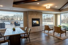 Lauderdale apartment for rent - the retreat dining room with table and chairs and a fireplace