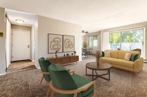 Brooklyn Park apartment for rent - a living room with a yellow couch and green chairs at Villa Del Coronado Apartments, Brooklyn Park