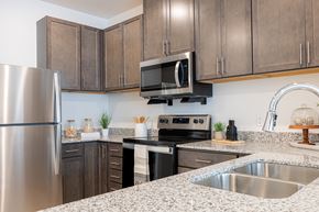 Mahtomedi apartment for rent - a kitchen with granite counter tops and stainless steel appliances