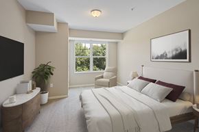 West St Paul apartment for rent - an image of a bedroom with a bed and a tv at The Winslow 62+ Apartments, West St Paul, MN, 55118