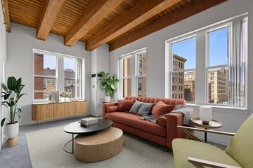 St. Paul apartment for rent - A living room with a red couch and a coffee table.