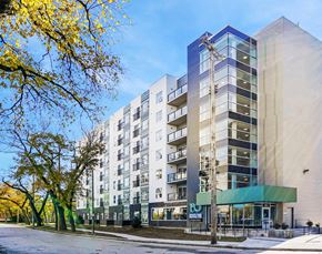 Winnipeg apartment for rent - an apartment building with a street in front of it