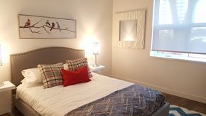 Winnipeg apartment for rent - a bedroom with a bed with pillows and a window