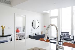 Winnipeg apartment for rent - A modern kitchen with a white countertop and a large sink.