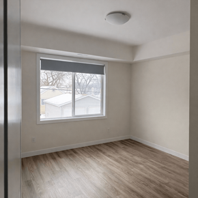 Winnipeg apartment for rent - A room with a window overlooking a snowy landscape.