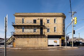 Winnipeg apartment for rent - A large building with a balcony on the second floor.