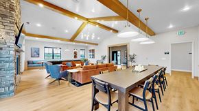 East Bethel townhouse for rent - A dining room with a long table and chairs.