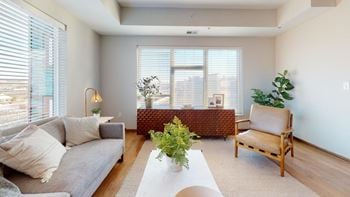 A living room with a couch and a table