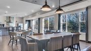 Minnetonka apartment for rent - A modern dining room with a long table and chairs.
