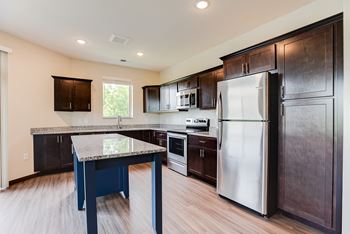 Beautiful kitchen with custom cabinetry and window over the sink