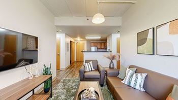 A living room with a couch and a table
