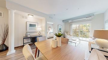 Victoria apartment for rent - a living room and dining room with a table and chairs