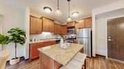 Victoria apartment for rent - a kitchen with a granite counter top and a stainless steel refrigerator at Victoria Flats, Victoria, 55386