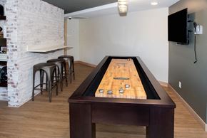 Eagan apartment for rent - Shuffleboard table and tv at Aspenwoods Apartments, Eagan