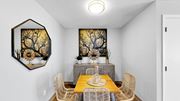 Bloomington apartment for rent - A dining room with a wooden table and chairs.