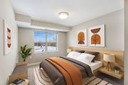 Inver Grove Heights apartment for rent - a bedroom with a bed and paintings on the wall