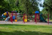 New Hope apartment for rent - a playground with several slides and other toys in a park