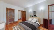 Minneapolis apartment for rent - a bedroom with a bed and two doors