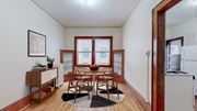 Minneapolis apartment for rent - a dining room with a table and chairs and a window