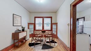 Minneapolis apartment for rent - a dining room with a table and chairs and a window