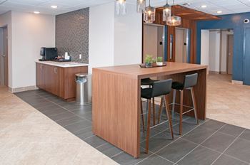 Fitted kitchen with island dining