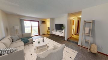 Bloomington apartment for rent - a living room with a couch and a coffee table
