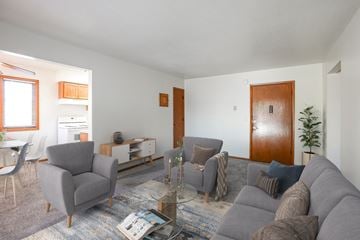 Bloomington apartment for rent - a living room with a couch and two chairs and a table