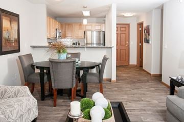 Chaska apartment for rent - a living room and dining room with a table and chairs and a kitchen