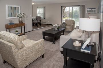 West Saint Paul apartment for rent - a living room with couches and chairs and a table