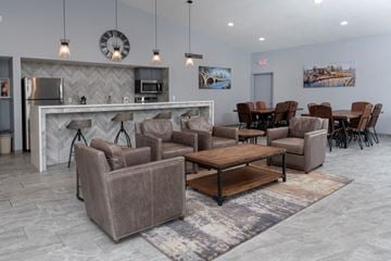 Eagan apartment for rent - a living room with couches and chairs and a table